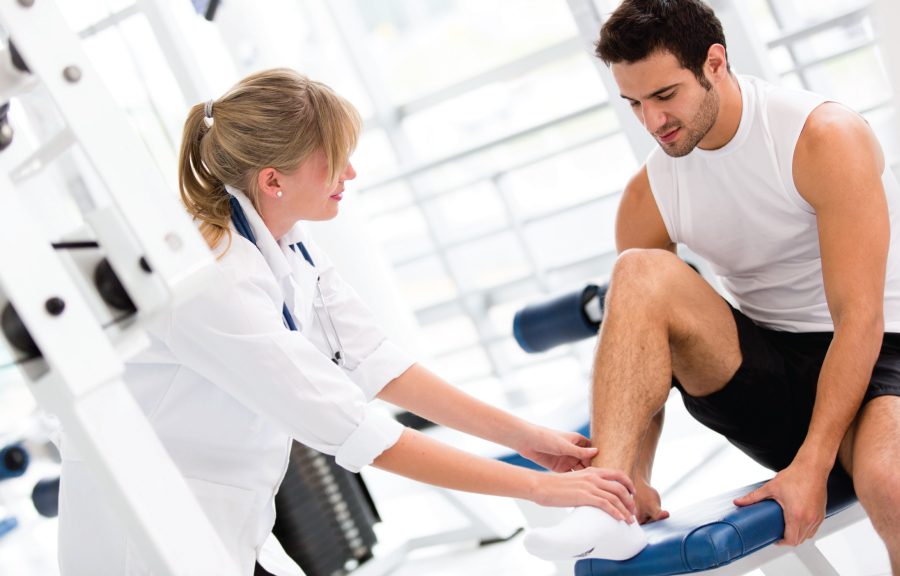 Doctor examining a patient's ankle.